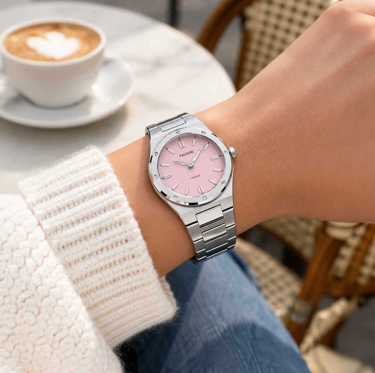 Women wearing a pink dial silver watch